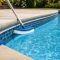 Clear swimming pool with waterline brushing and pool water test kit