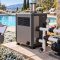 Pool heater, pump, filter and checklist at a backyard pool prepared for a freeze warning