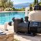 Variable speed pool pump and schedule checklist beside a clear backyard swimming pool